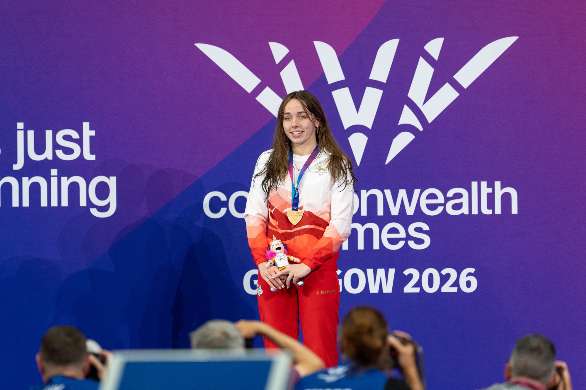 Team England athletes celebrating on the track